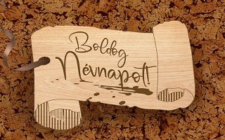 A képen egy papírtekercs látható, boldog névnapot felirattal.